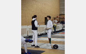 Noémie en plein coaching d'Antoine durant la finale.